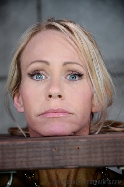 Blonde female Simone Sonay is rendered helpless in a basement dungeon - image content by freshbear